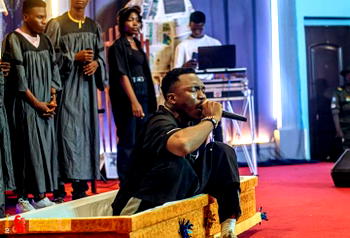 Photos: Drama as Nigerian gospel artiste arrives stage in coffin