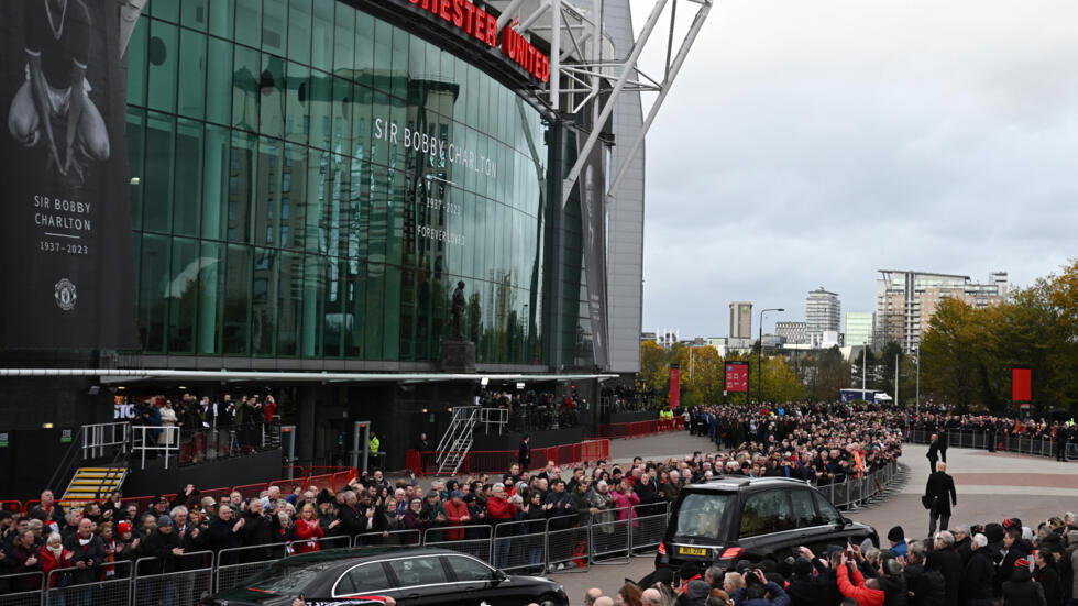 Thousands line Manchester streets to bid final farewell to Bobby Charlton