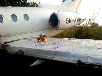 One dead as plane hits car
