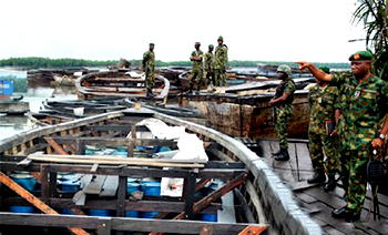 Oil Theft: Navy destroys over 6,000 empty jerrycans, wooden boats in Badagry