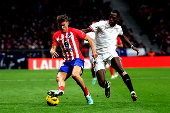 Ten-man Atletico edge Sevilla to climb to third in La Liga