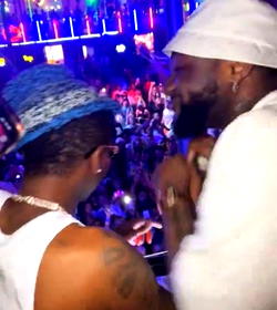 Video: Moment Davido and Wizkid spotted having fun, hugging each other at Lagos club