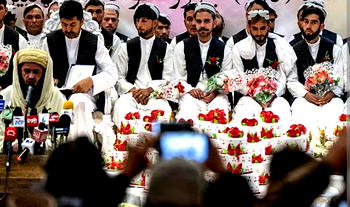 Afghans marry in mass ceremony in bid to cut costs