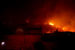 Hundreds battle wildfire threatening South Africa naval base