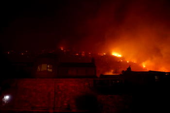 Hundreds battle wildfire threatening South Africa naval base
