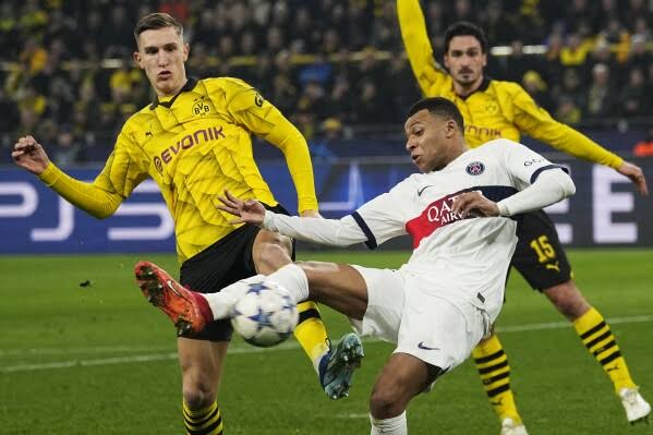 PSG through to last 16 despite Dortmund draw