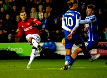 Man United avoid FA Cup upset at Wigan