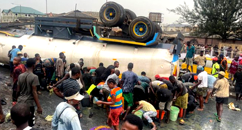 Residents scoop fuel as tanker overturns in Lagos