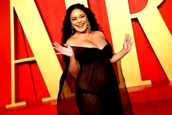 Actress Vanessa Hudgens shows off baby bump in flashing gown