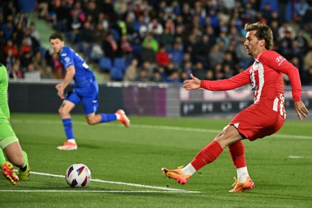 Griezmann hat-trick secures Champions League spot for Atletico