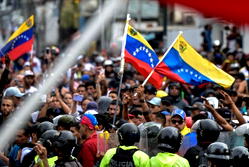 Venezuela protesters teargassed as opposition cries foul over Maduro reelection