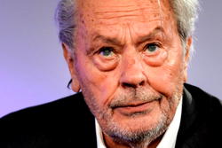 Fans mourn as film legend Delon is buried near his dogs