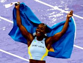 Julien Alfred overcomes obstacles to be crowned Olympic sprint queen