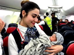 What nationality is given to a child born mid-flight?