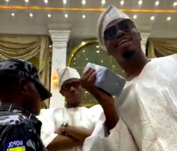 Okoya’s son apologises as police arrest officer in viral naira spraying saga