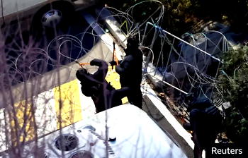 Investigators cut barbed wires, scale fence to arrest South Korea’s impeached president