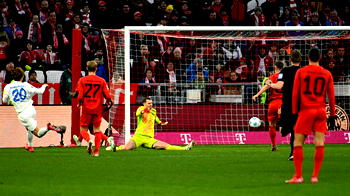 Bayern survive late Kiel fightback to go nine points clear