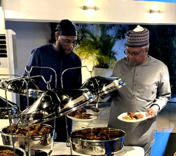Video: Burna Boy joins Dangote to break Ramadan fast