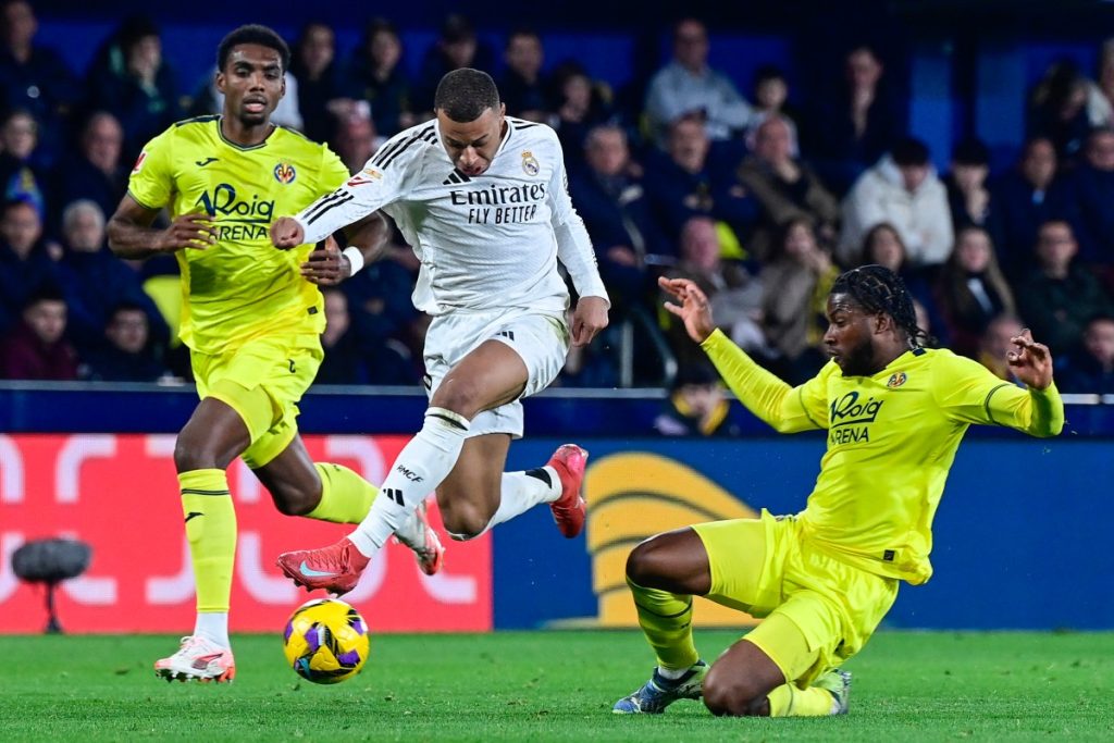 Mbappe double at Villarreal takes Real Madrid top