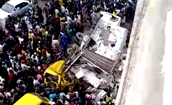 Truck plunges off bridge in Lagos, lands on 2 commercial buses