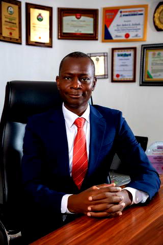 Nigerian billionaire Azibaola Robert spotted building his mansion himself