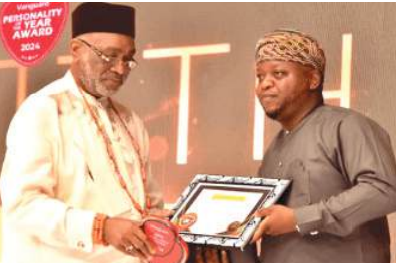 •Senator Ben Obi (left), presenting Vanguard's Auto Icon Award to Taiwo Shittu, MD/CEO, Lanre Shittu Motors, and his wife.