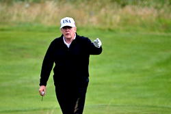 Trump hits Scottish golf course as protesters rally