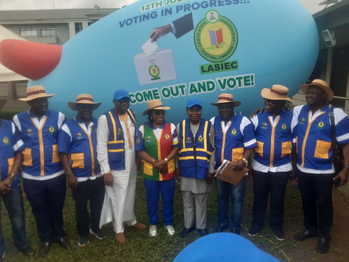 Photos: Residents play football as LASIEC chair, security agents monitor election