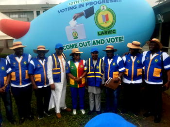 Photos: Residents play football as LASIEC chair, security agents monitor election