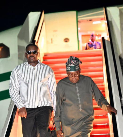 Photos: Tinubu returns to Abuja from vacation