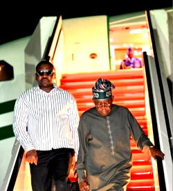 Photos: Tinubu returns to Abuja from vacation