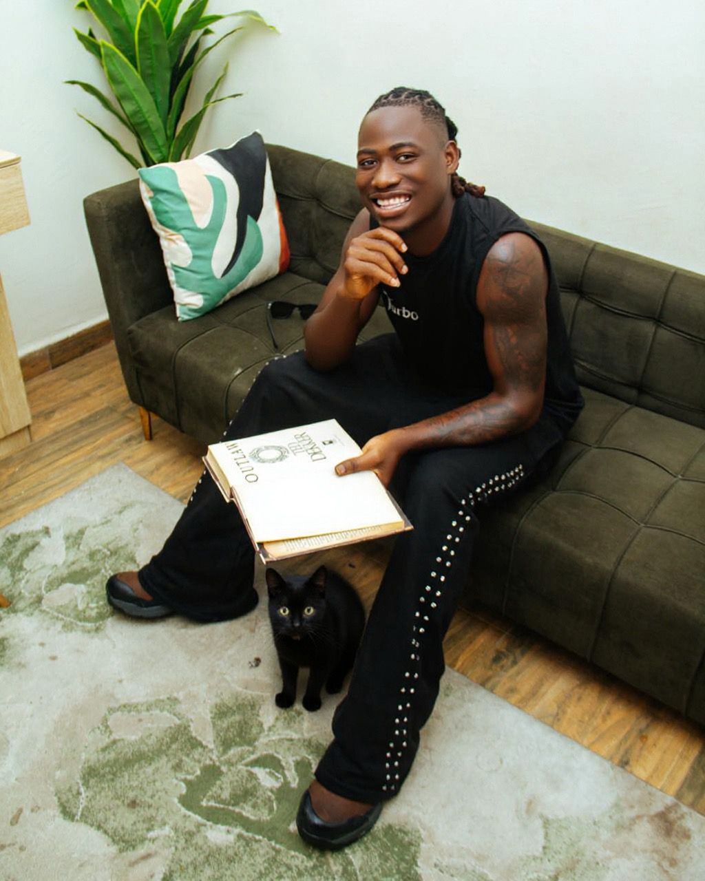 “Black cat is who I am” — Nigerian artist declares