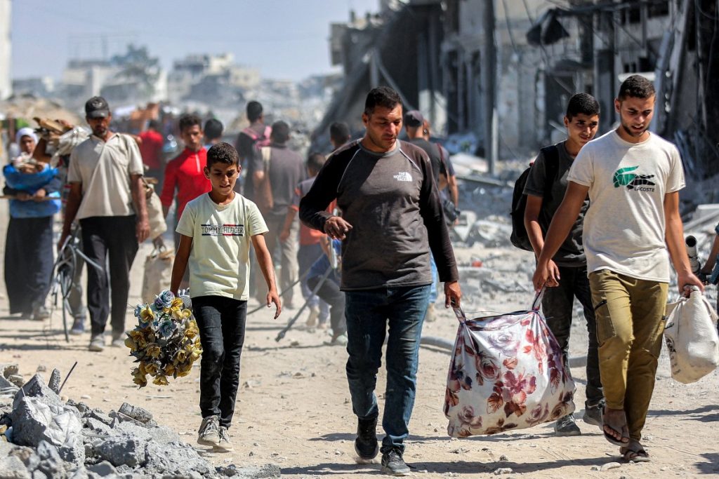 ‘Full of sorrow’ – Gazans trek home as truce begins