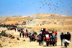 Photos: Israel ceases fire as Gazans start returning home