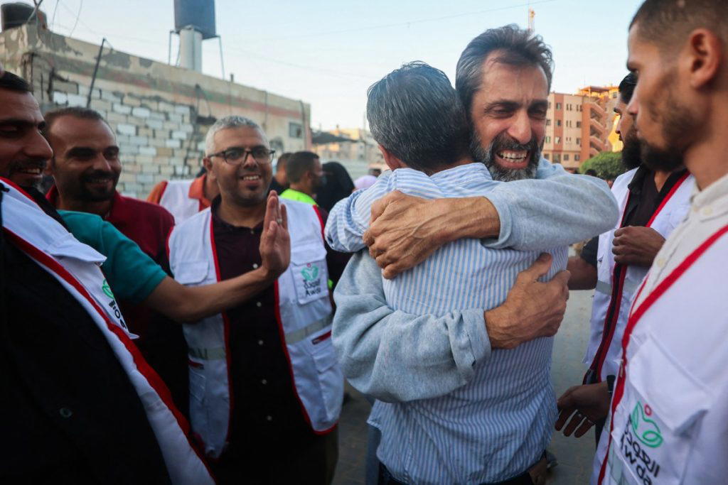 Photos: Freed Israeli hostages hug loved ones in tears of joy