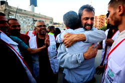 Photos: Freed Israeli hostages hug loved ones in tears of joy