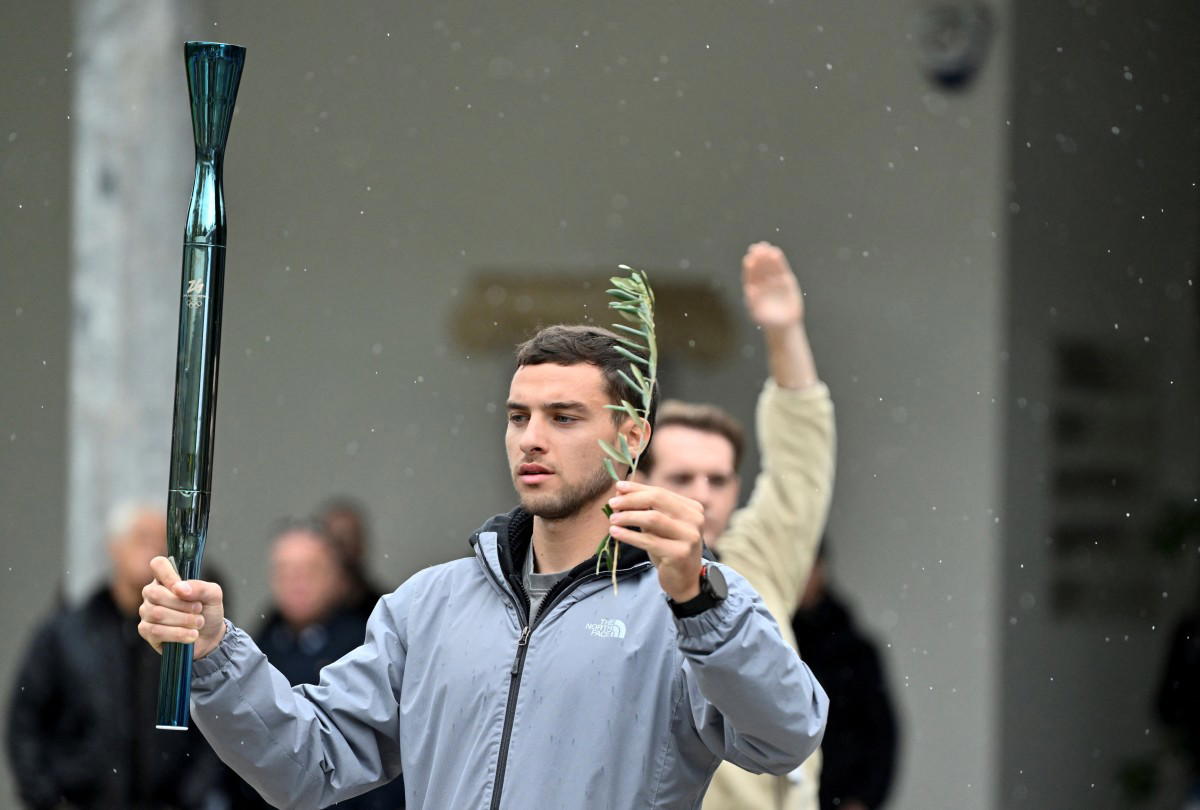 Rain forces changes to 2026 Winter Olympics flame ceremony