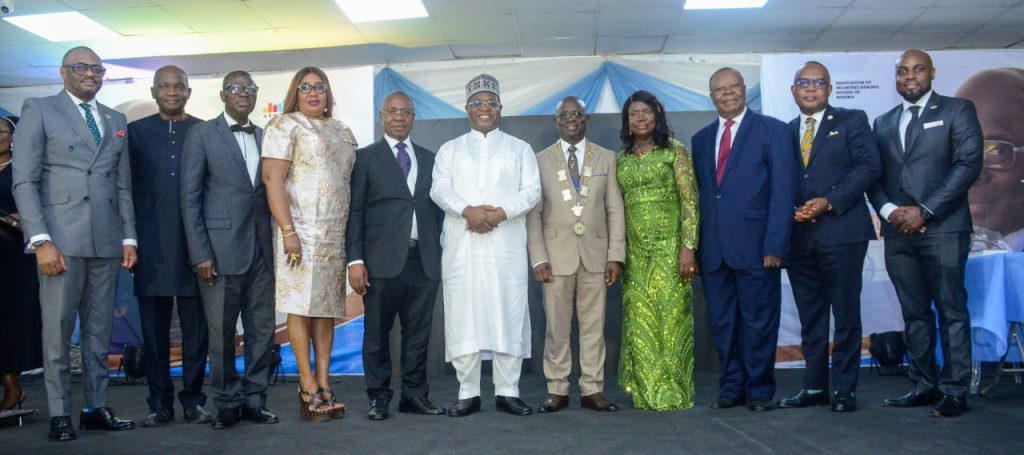 L-R: Chief Executive Officer, Nigerian Exchange Limited (NGX) Jude Chiemeka; Managing Director, NASD PLC, Eguarekhide Longe; 2nd Vice Chairman, Association of Securities Dealing Houses of Nigeria (ASHON), Oluwadare Adejumo; 1st Vice Chairman, Ifeyinwa Ejezie; Immediate Past President, Sam Onukwue; Group Chairman, Nigerian Exchange Group PLC, Alhaji Umaru Kwairanga; President ASHON, Sehinde Adenagbe, his wife, Modupe; Past President, ASHON, Chief Onyewenchukwu Ezeagu; 13th President, Chartered Institute of Stockbrokers (CIS), Oluropo Dada and Chief Executive Officer, NGX Regulation, Olufemi Shobanjo during Investiture of Adenagbe as the 6th Chairman, ASHON in Lagos.
