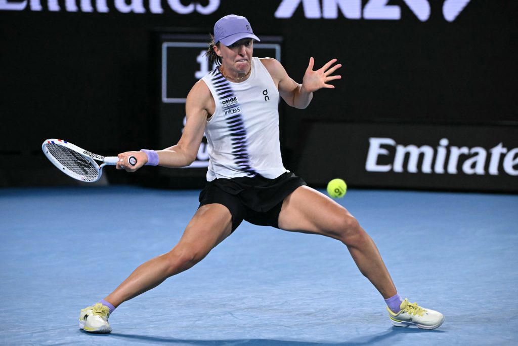 Swiatek survives roller coaster to reach Australian Open last 16