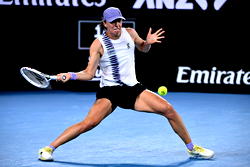 Swiatek survives roller coaster to reach Australian Open last 16