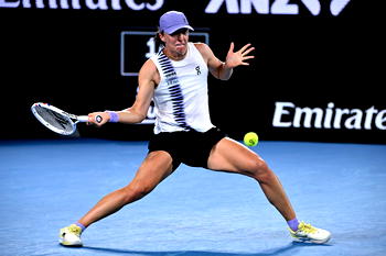 Swiatek survives roller coaster to reach Australian Open last 16
