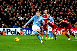 Man City beat Liverpool 2-1 to rekindle title hopes
