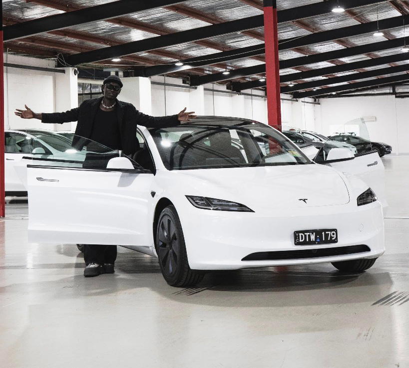 Slate Nation makes history as first South Sudanese-Australian artist to purchase a Tesla