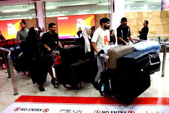 Drones fall near Dubai airport, ships hit as Iran presses on with attacks
