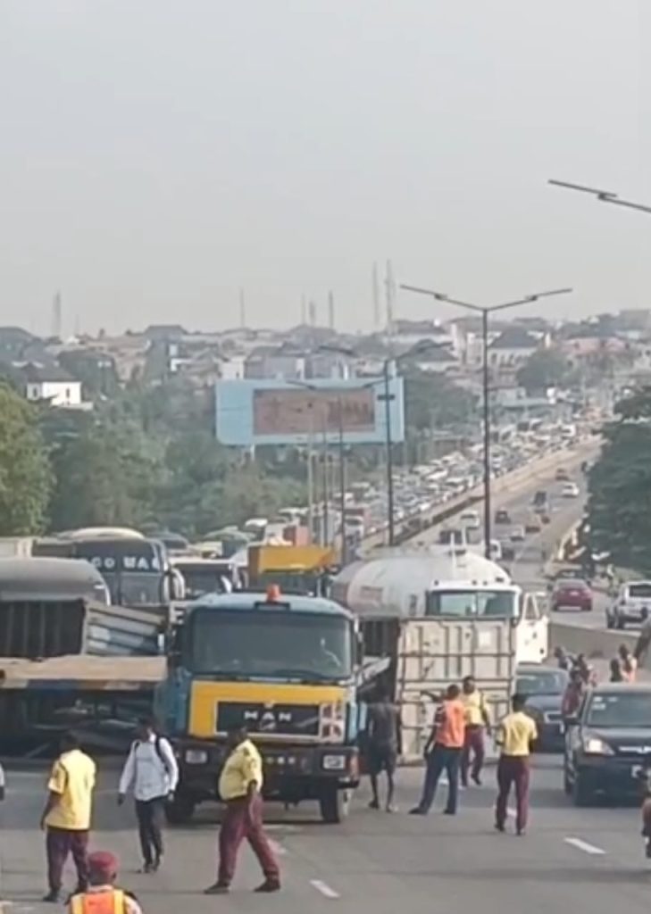 Motorists trapped for hours as containers fall on Otedola Bridge