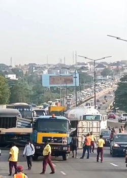 Motorists trapped for hours as containers fall on Otedola Bridge