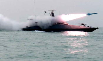 Three vessels set ablaze as Iran threatens to close Gulf oil chokepoint