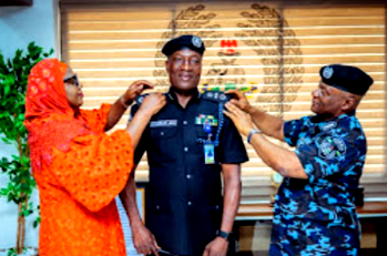 IGP Disu decorates Jimoh Moshood Olohundare as Assistant Inspector-General of Police