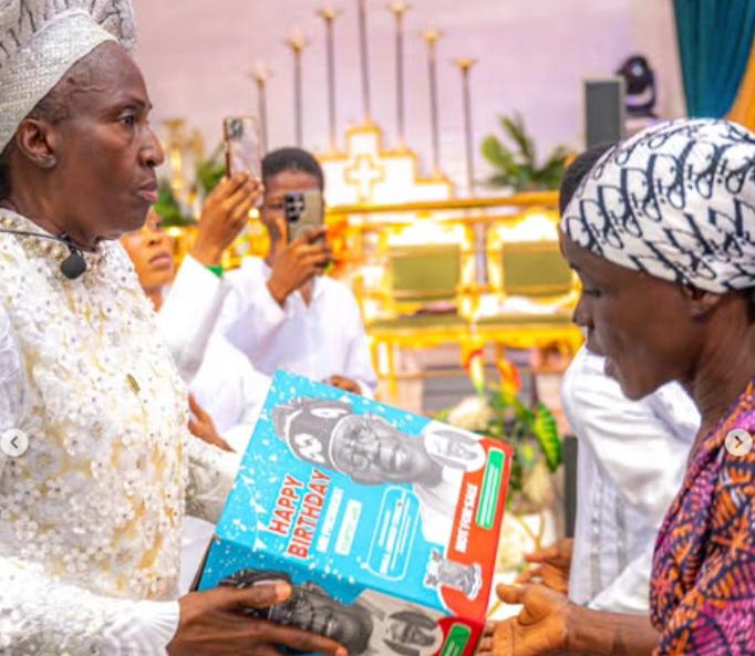 Video: Rev Esther Ajayi shares Tinubu-branded Easter packages in church