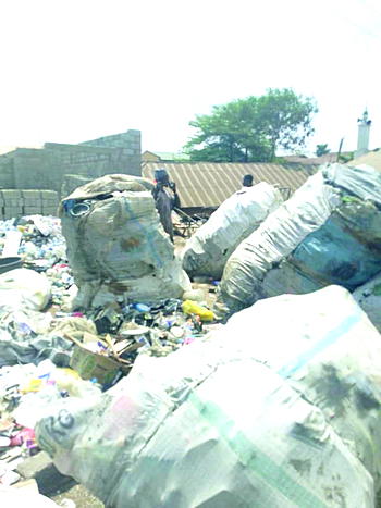 Abuja satellite town dumpsite residents lament hellish stench